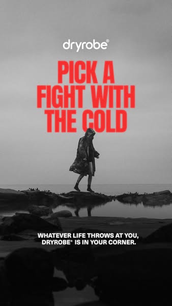 This image ad for dryrobe features a person walking on a rocky beach wearing a dryrobe. The ad copy encourages viewers t