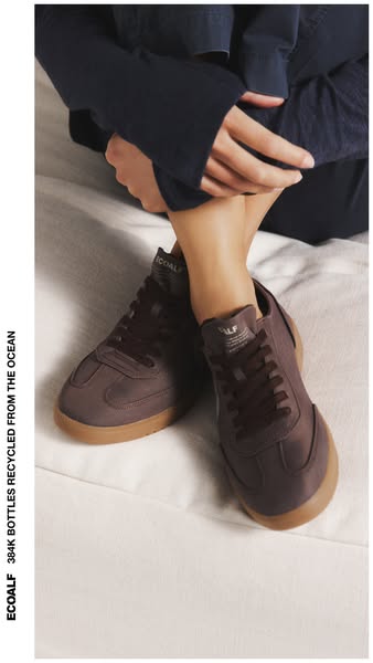 This ad showcases brown sneakers made by ECOALF, and highlights that 384,000 plastic bottles were recycled from the ocea