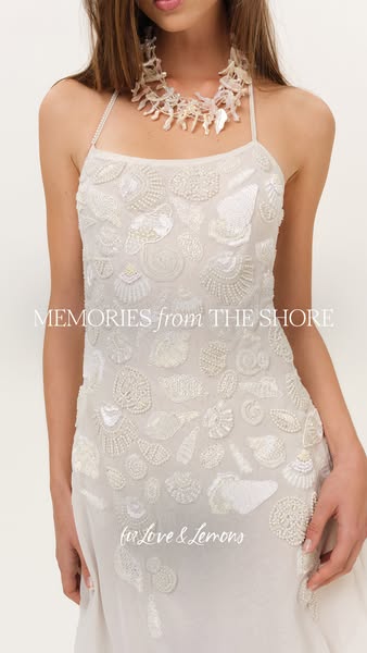 This image ad showcases a dress from For Love & Lemons. The dress is embellished with beadwork in the shape of seash
