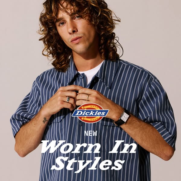 An image ad featuring a man in a blue and white striped shirt by Dickies, highlighting new worn-in styles.