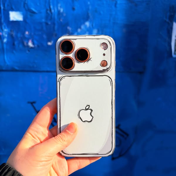 This ad features a hand holding a phone case with a cartoon-like design. The background is a blue wall with graffiti. Th