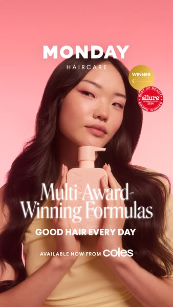 Image ad for MONDAY Haircare featuring a young woman with long wavy hair holding a bottle of the product, touting its aw