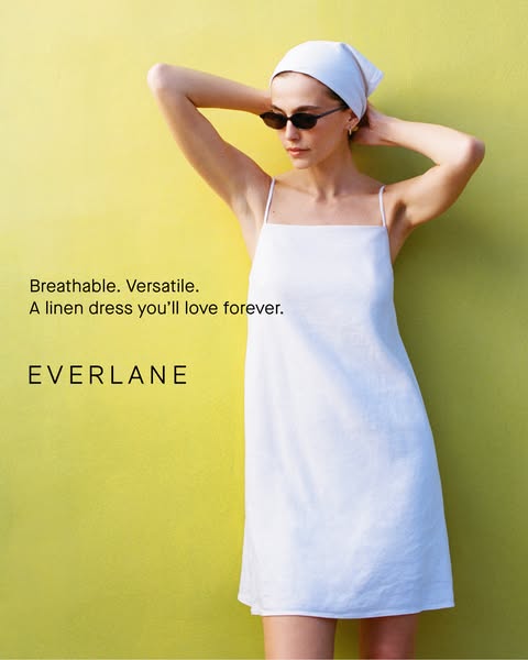 This image ad for Everlane features a woman posing against a yellow wall while wearing a white linen dress. The ad highl