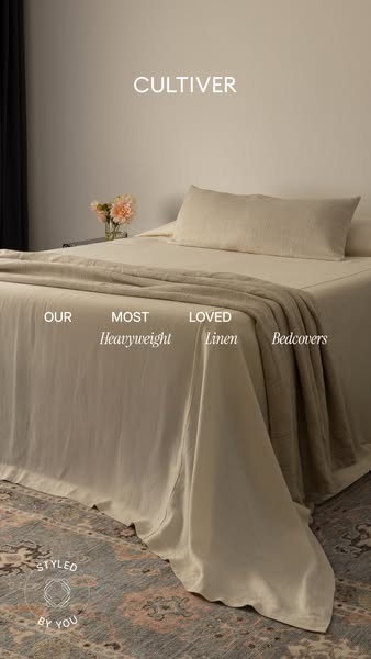 An image ad that shows a made bed with a duvet cover, fitted sheet, and pillowcases, promoting the company's heavywe