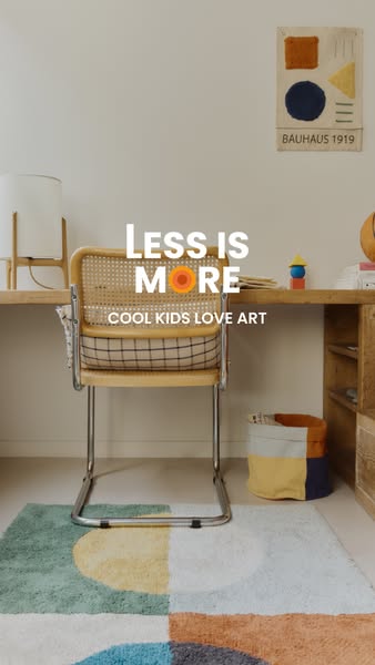 This ad showcases an artistic children's room with a focus on a colorful, geometric rug. The message 'Less is Mo