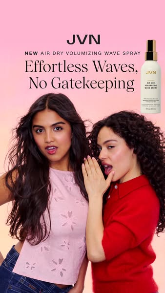 This ad is for JVN's Air Dry Volumizing Wave Spray. It features two young women with wavy hair as they seem to share