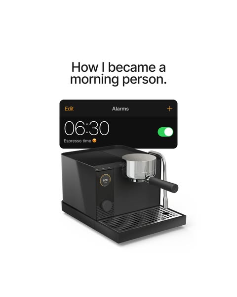 This ad features a high-quality photo of a black espresso machine below a simulated iPhone alarm screen, which is set fo