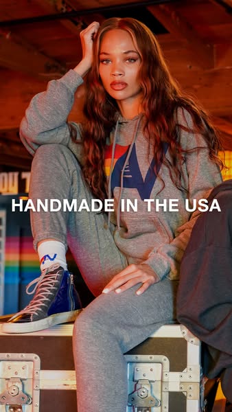 This ad features a model wearing a gray sweatsuit and high-top sneakers. The ad highlights that the clothing is handmade