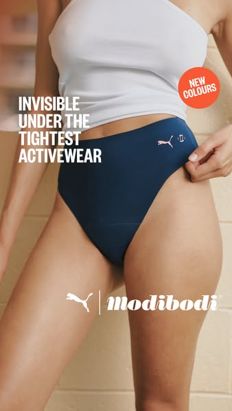 This image ad features a woman wearing Puma x Modibodi underwear under a white top. The ad emphasizes the underwear'