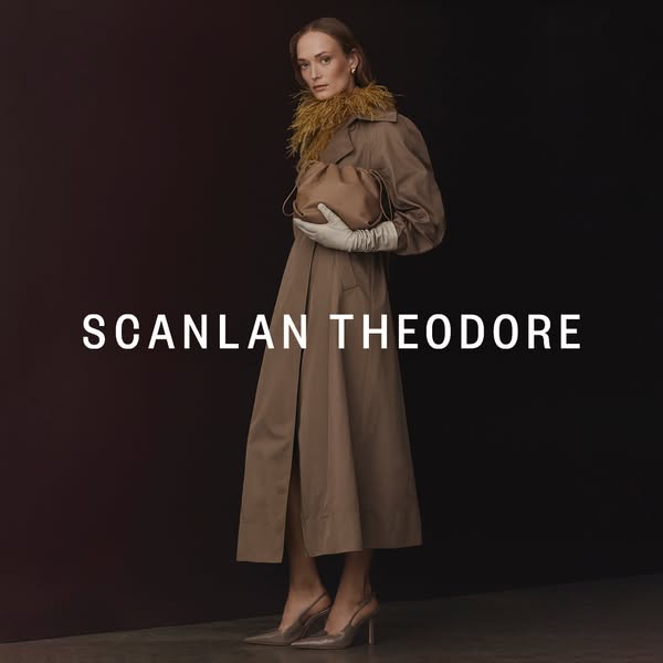 This ad features a woman wearing a Scanlan Theodore trench coat, holding a small bag, and wearing heels. The brand name 