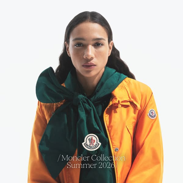 This ad showcases the Moncler collection summer 2026 with an image of a model wearing a jacket and scarf from the collec