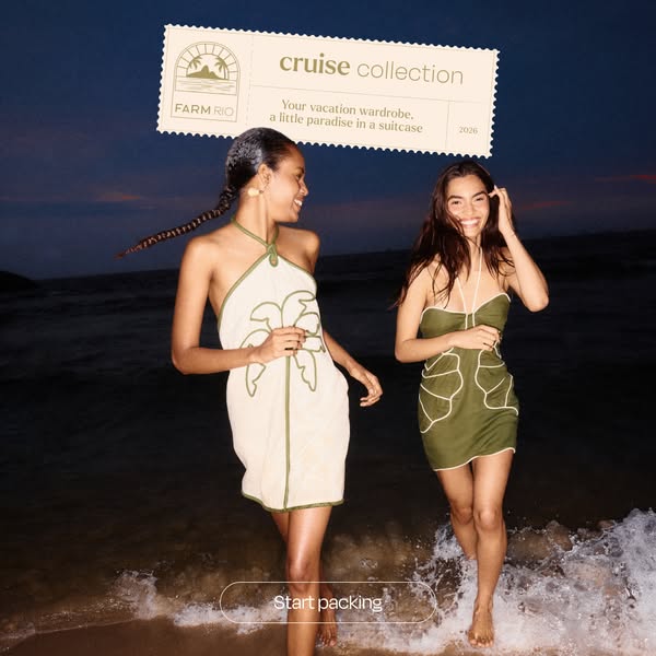 This image ad for FARM Rio features two women walking on a beach at dusk, showcasing the brand's cruise collection. 