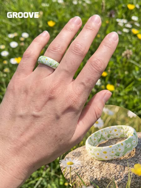 This image showcases a Groove ring with a floral design, highlighting its aesthetic appeal and suitability for outdoor a