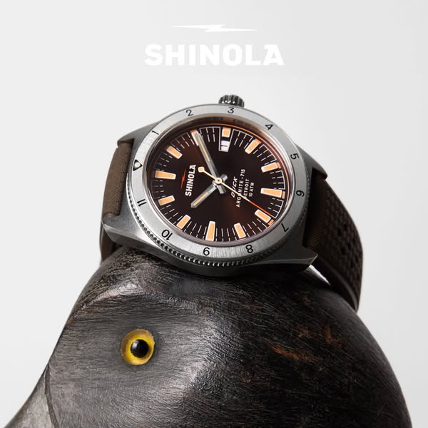 This ad showcases the Shinola Duck Arginite-715 Detroit watch placed on top of a black duck decoy, highlighting its craf