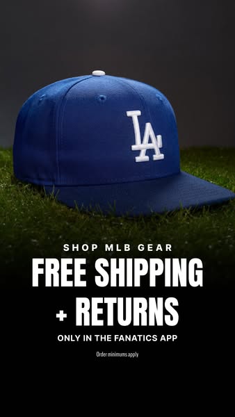 This image ad promotes MLB gear available through the Fanatics app. It features a close-up of a blue Los Angeles Dodgers