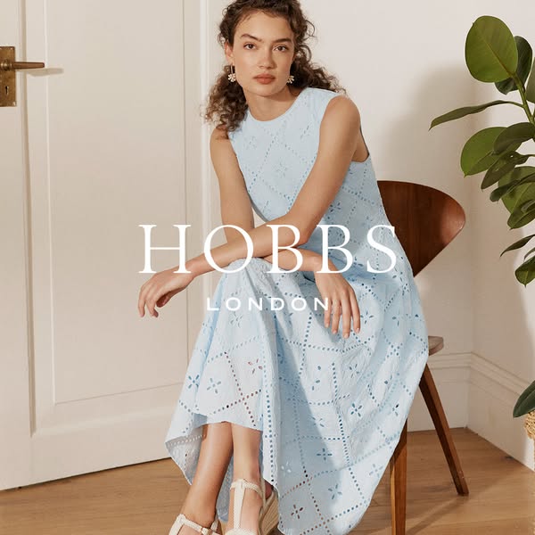 This ad features a light blue, eyelet dress from Hobbs London. The ad features a light and airy color palette to evoke a