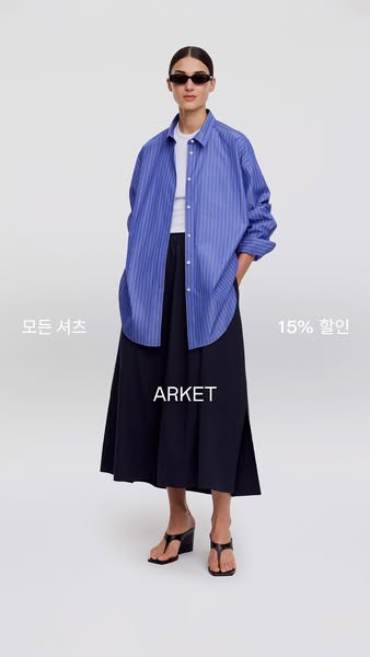 This image ad showcases an ARKET-branded outfit comprising a button-down shirt, a midi skirt, and sandals. The ad featur
