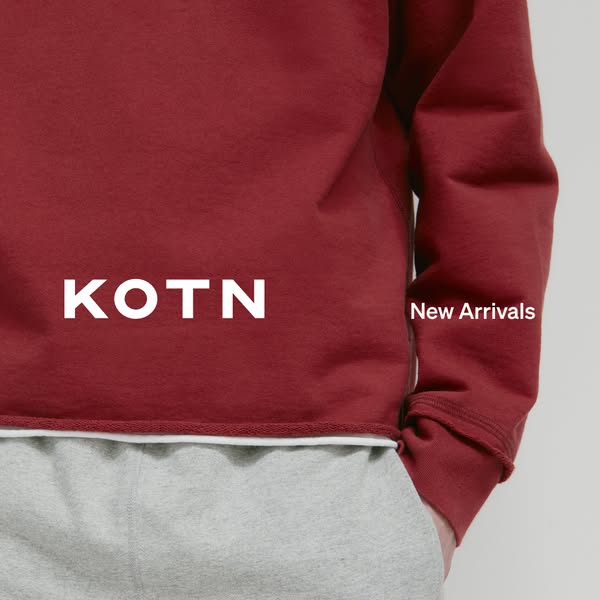 This ad features a close-up shot of a person wearing a Kotn sweatshirt, with the brand name prominently displayed. The a