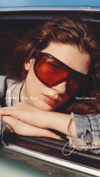 This image ad showcases Jimmy Fairly sunglasses worn by a model in a casual, outdoor setting, highlighting the brand'