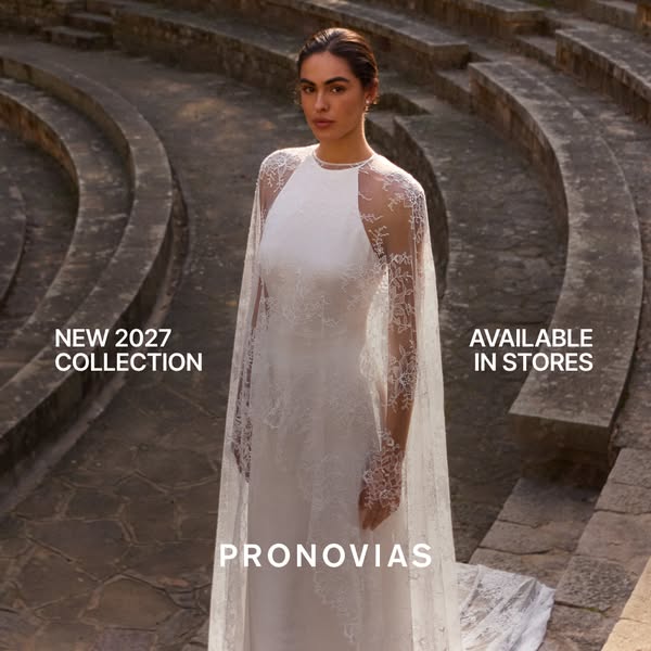 This Pronovias ad showcases a model wearing a white wedding dress from the New 2027 Collection in an outdoor setting. Th