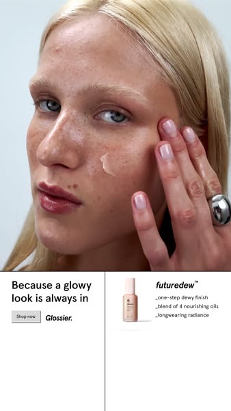 This image ad for Glossier's Futuredew product features a fair-skinned person applying the product to their face, wi