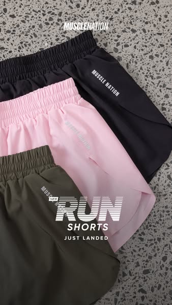 This ad for Muscle Nation promotes their new running shorts in black, pink, and green. The image showcases the shorts fo