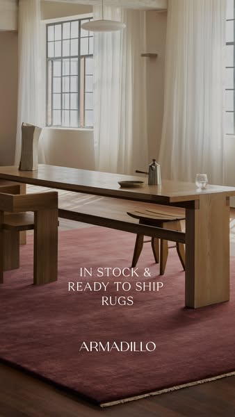 This ad showcases a red-toned rug by the brand Armadillo, emphasizing its availability and immediate shipping. The setti