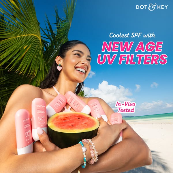This ad features a woman on the beach, surrounded by bottles of Dot & Key sunscreen. She is holding a watermelon hal