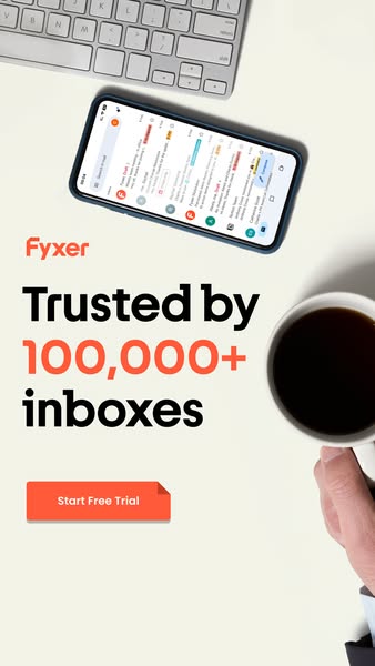 This ad for Fyxer features a phone displaying an email inbox, a keyboard, and a mug of coffee on a desk. It mentions the