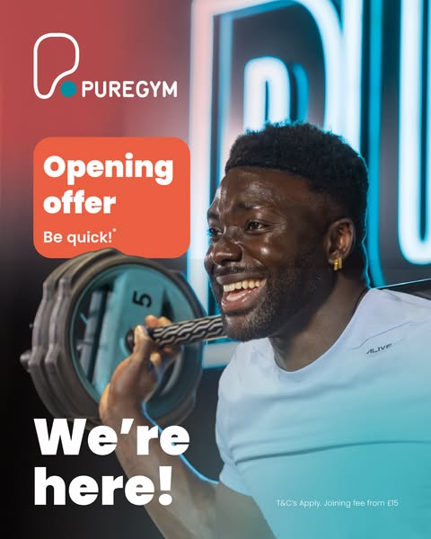 Ad for PureGym featuring a smiling man with a barbell on his shoulders. The ad promotes their opening offer.