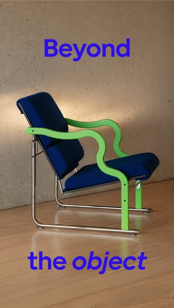 An image ad for a blue lounge chair with green arm rests. The ad showcases the chair against a neutral wall and wood flo