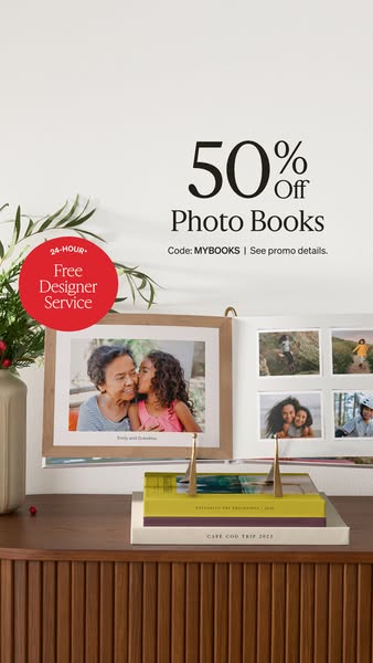 This image ad promotes photo books with a 50% discount and a free designer service.