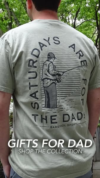 This ad features a man wearing a t-shirt with a graphic print design of a person fishing that says 'Saturdays are fo