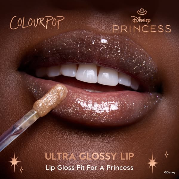 This ad features a close-up of a woman's lips with a shimmery lip gloss applied. The ad highlights the product's