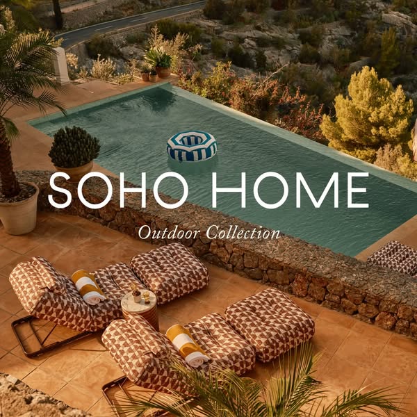 This ad for Soho Home showcases their outdoor collection, featuring lounge chairs and a view of a villa with a pool, cre