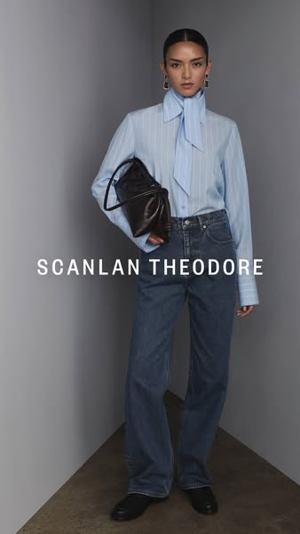 This ad features a woman wearing SCANLAN THEODORE clothing and carrying a SCANLAN THEODORE bag. The brand's name is 