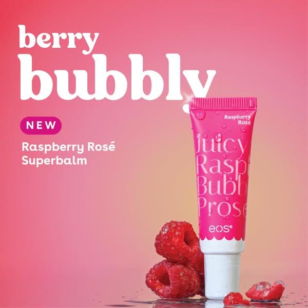 The ad is for eos Raspberry Rosé Superbalm. It is an image featuring the lip balm tube, raspberries, and a gradient pink