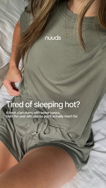 This ad features a woman wearing a matching olive green pajama set in bed. The ad copy highlights the problem of sleepin