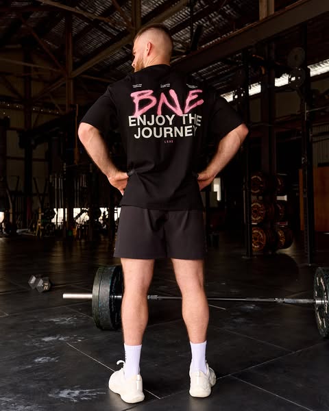 This ad features a person wearing a black t-shirt with the brand's logo and slogan, emphasizing the brand's asso