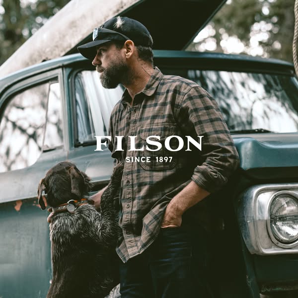 This ad showcases Filson's brand heritage through a high-quality, aspirational image. It features a bearded man in a