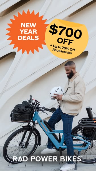 This image ad for Rad Power Bikes showcases a man holding a bike helmet next to a blue Rad Power e-bike. The ad highligh