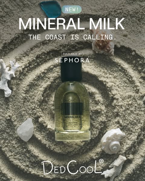 This ad showcases DedCool's Mineral Milk fragrance against a background of sand with seashells and corals. The ad hi