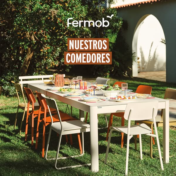 This ad showcases Fermob outdoor furniture arranged in an outdoor dining setting, emphasizing the brand's design aes
