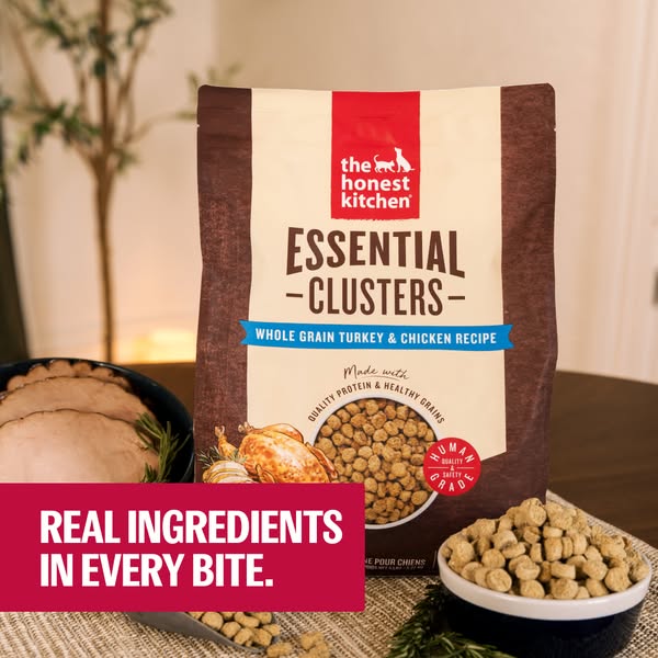 This image ad promotes The Honest Kitchen's Essential Clusters Whole Grain Turkey & Chicken Recipe dog food. The