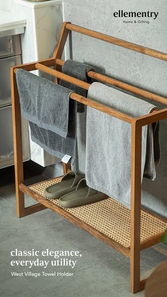 This ad features the ellementry West Village Towel Holder. The towel holder is displayed indoors in a bathroom or simila
