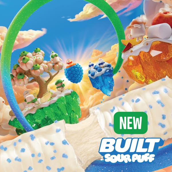 This image ad showcases a Built Sour Puff candy bar with a whimsical, candy-themed landscape in the background to emphas