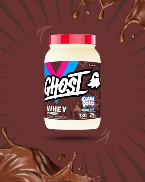 This ad promotes Ghost brand whey protein in a Cocoa Puffs cereal milk flavor. The visual style uses dynamic splashes an