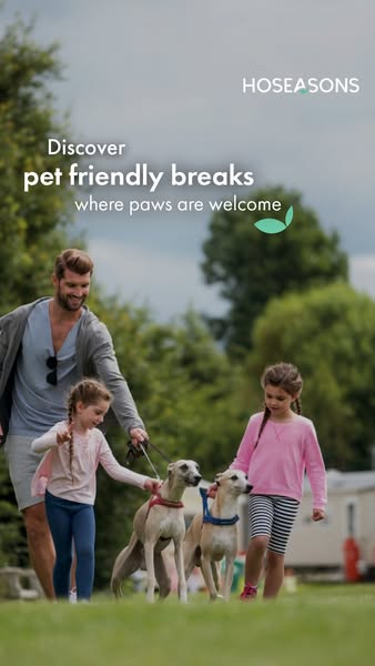 This image ad promotes pet-friendly breaks offered by Hoseasons. The ad features a family walking their dogs in a green,