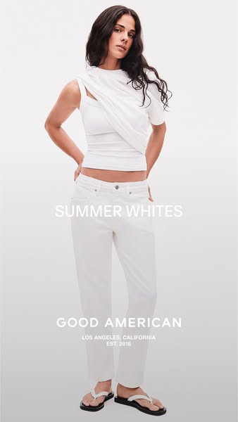 This ad for Good American highlights their summer whites collection. A model is wearing a white top and jeans, set again