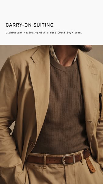 A close-up shot of a man's torso in a neutral-toned suit, with text at the top describing the suit as "carry-on